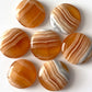 Banded Honey Calcite Round Palm Stone