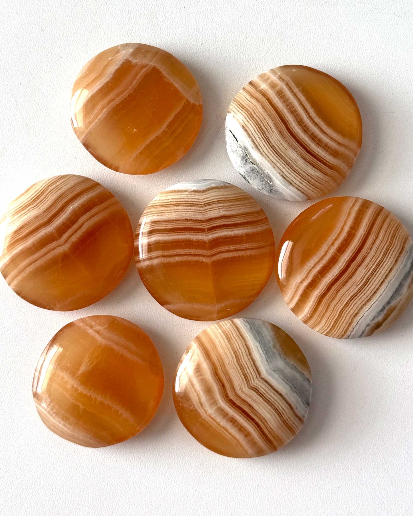 Banded Honey Calcite Round Palm Stone