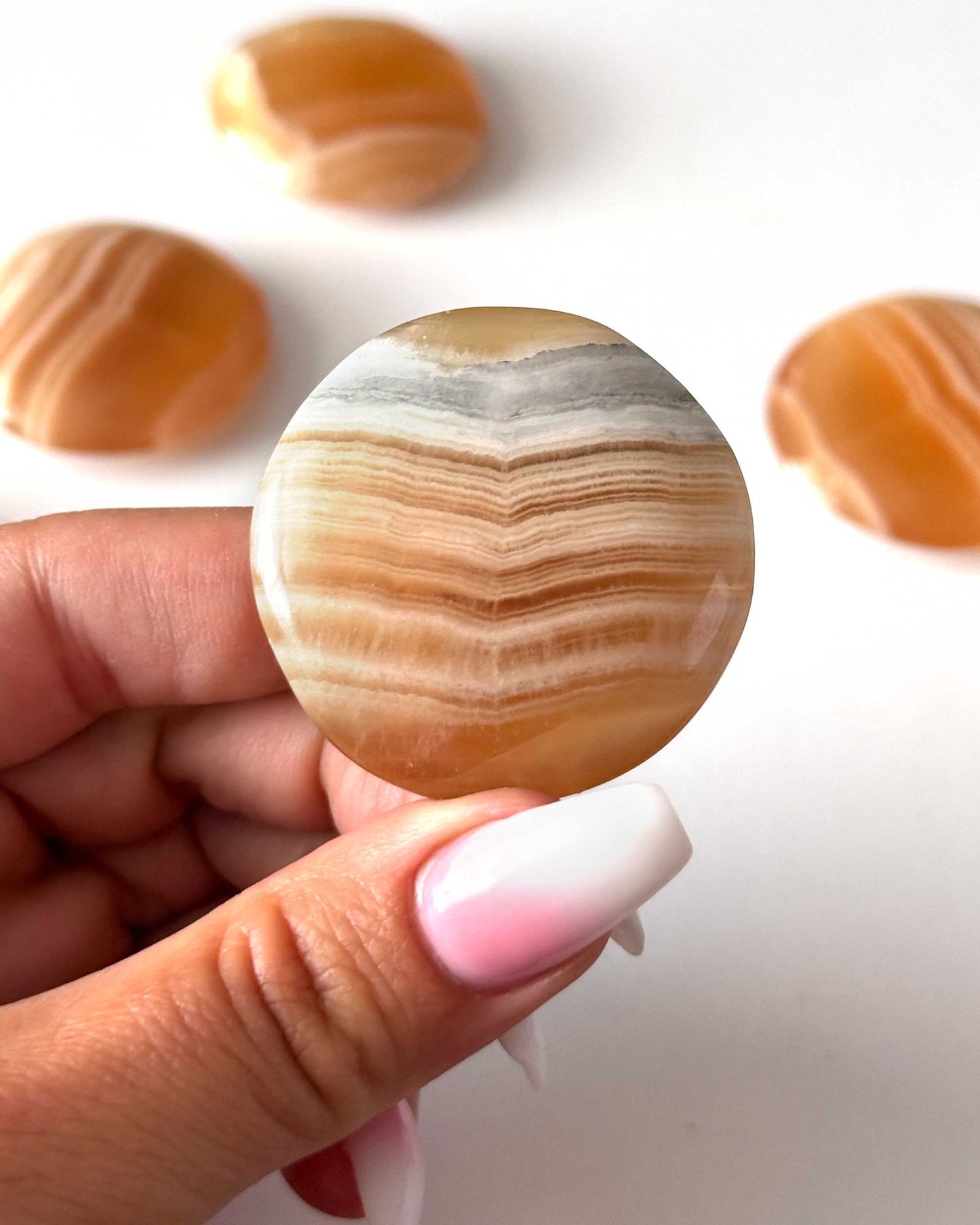 Banded Honey Calcite Round Palm Stone