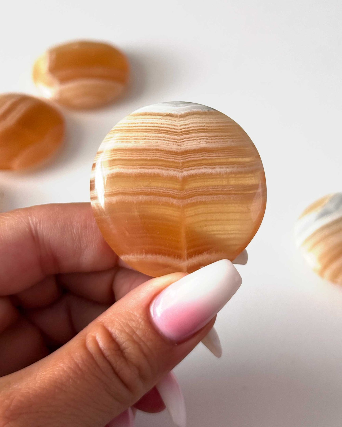 Banded Honey Calcite Round Palm Stone