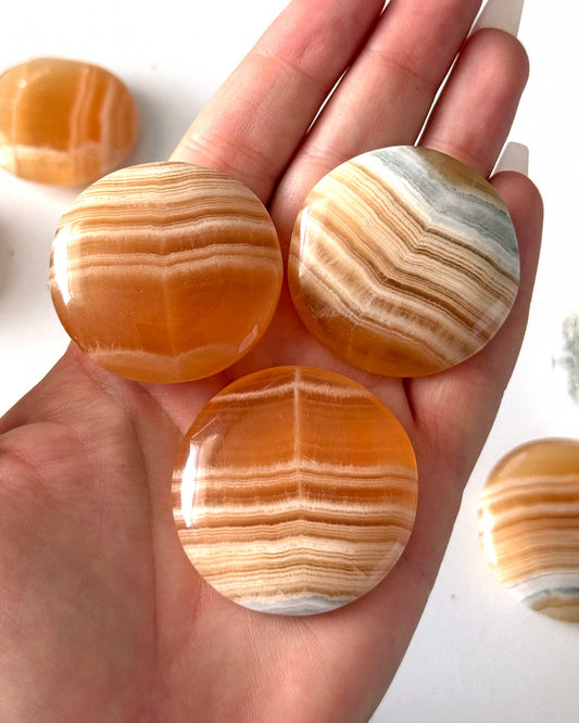 Banded Honey Calcite Round Palm Stone