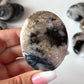 Black Flower Agate Palm Stone