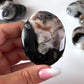 Black Flower Agate Palm Stone
