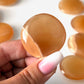 Honey Calcite Round Palm Stone