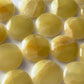 Lemon Calcite Round Palm Stone