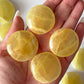 Lemon Calcite Round Palm Stone