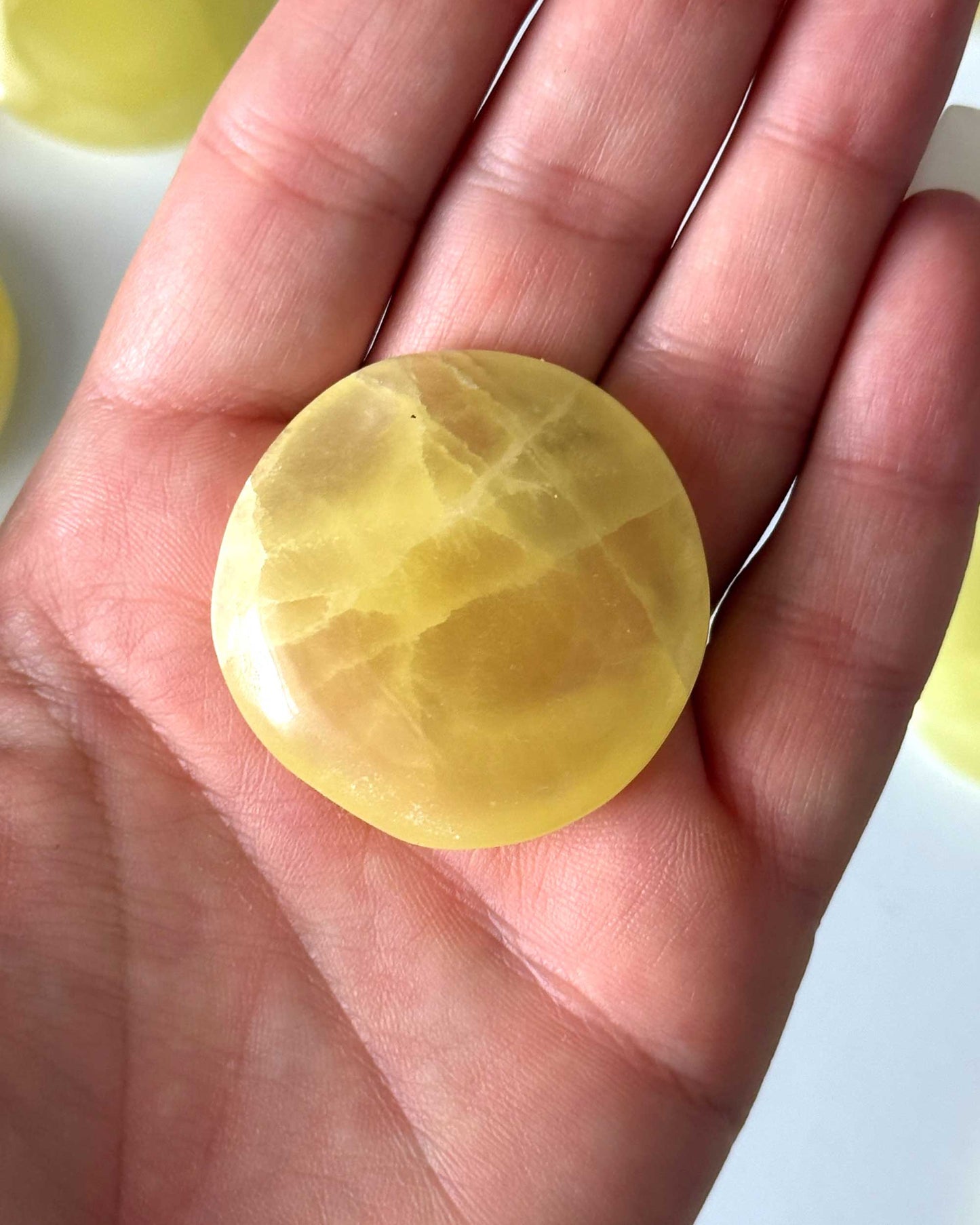 Lemon Calcite Round Palm Stone