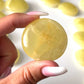 Lemon Calcite Round Palm Stone
