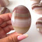 Pink Banded Onyx Palm Stone