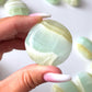 Pistachio Calcite Round Palm Stone